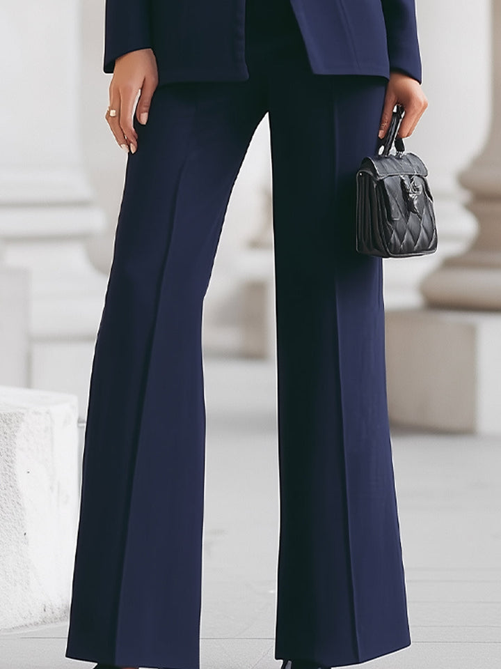 Solenne tailored navy power suit – model wearing