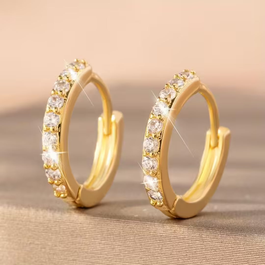 Main shot of the mini gold hoop earrings