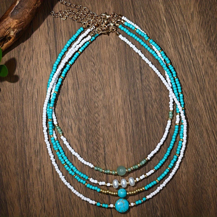 Stack of beaded bracelets worn together on a wrist