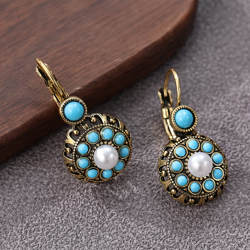 Both earrings displayed together on a jewellery tray