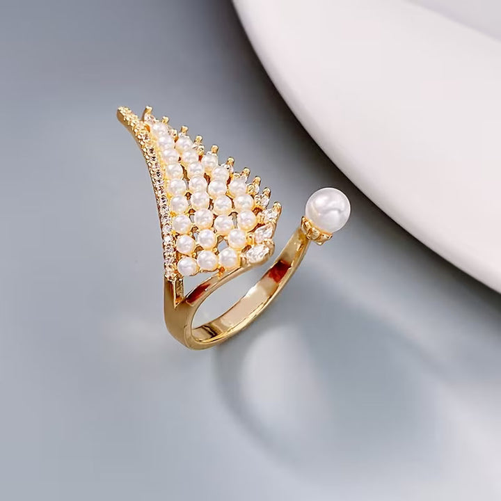 Model wearing the pearl wing ring on one finger