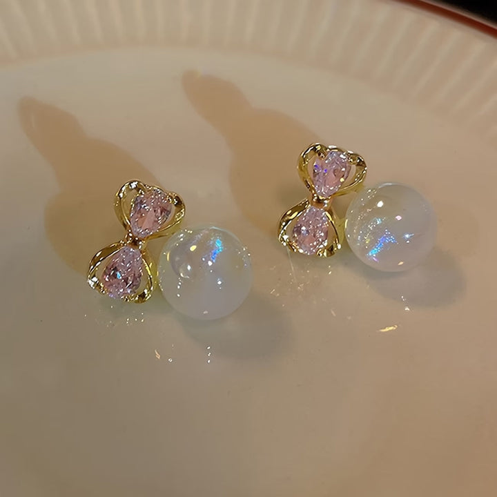 Earrings laid flat on a jewellery tray