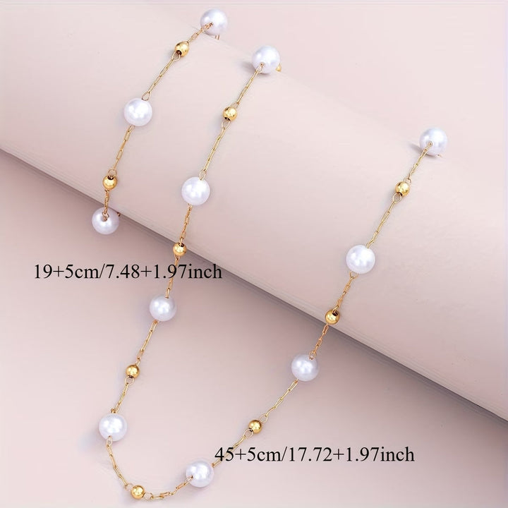 Dainty pearl chain earrings shown beside the matching necklace