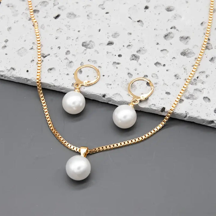 Pearl necklace set with layered strands on a white background