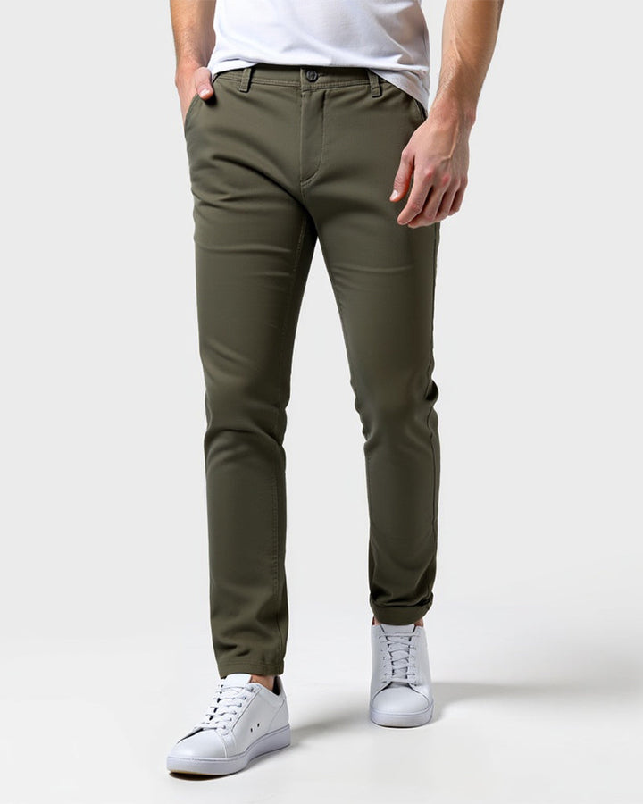 Everyday slim chinos in olive green, front view on model