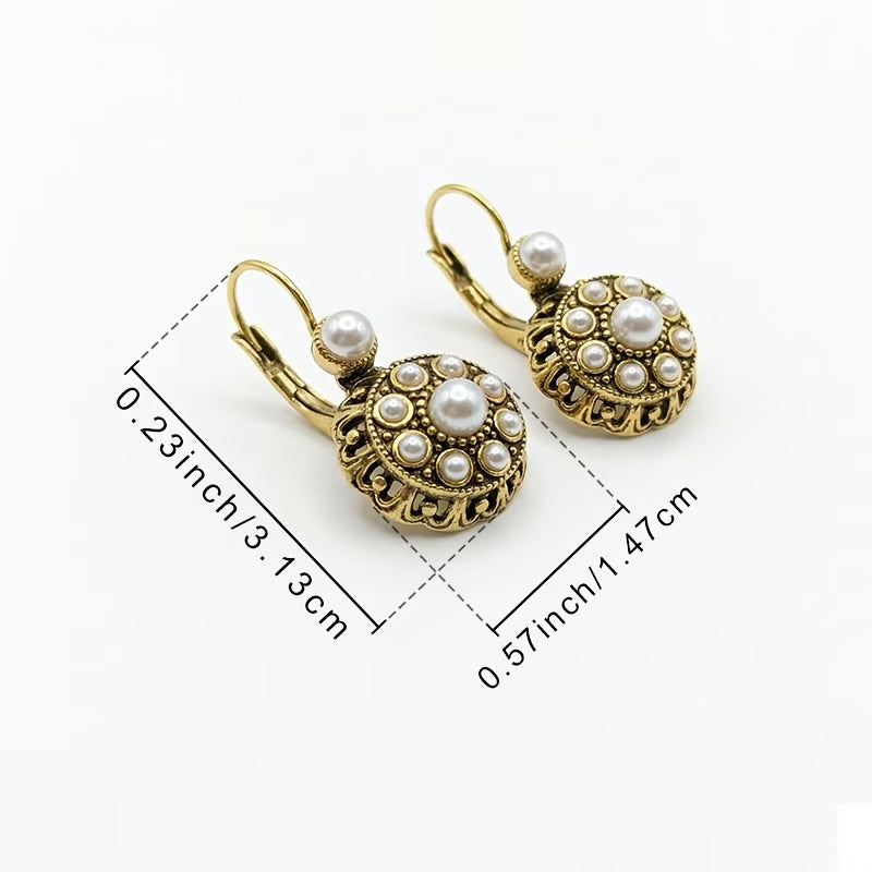 Both earrings displayed together on a jewellery tray