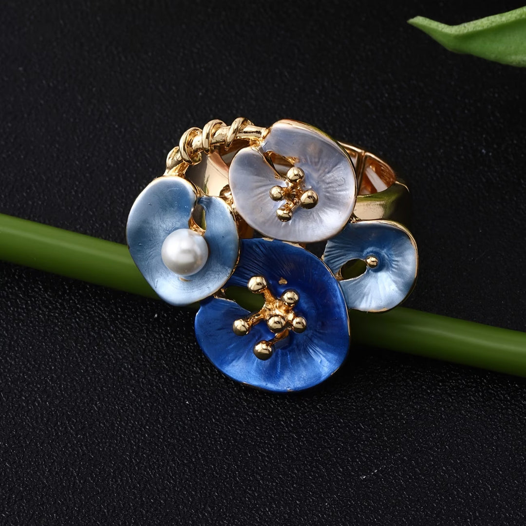 Close-up of the blue enamel petals surrounding the pearl