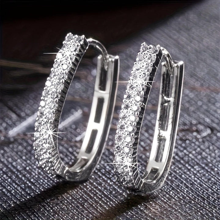 Both earrings displayed together on a jewellery tray