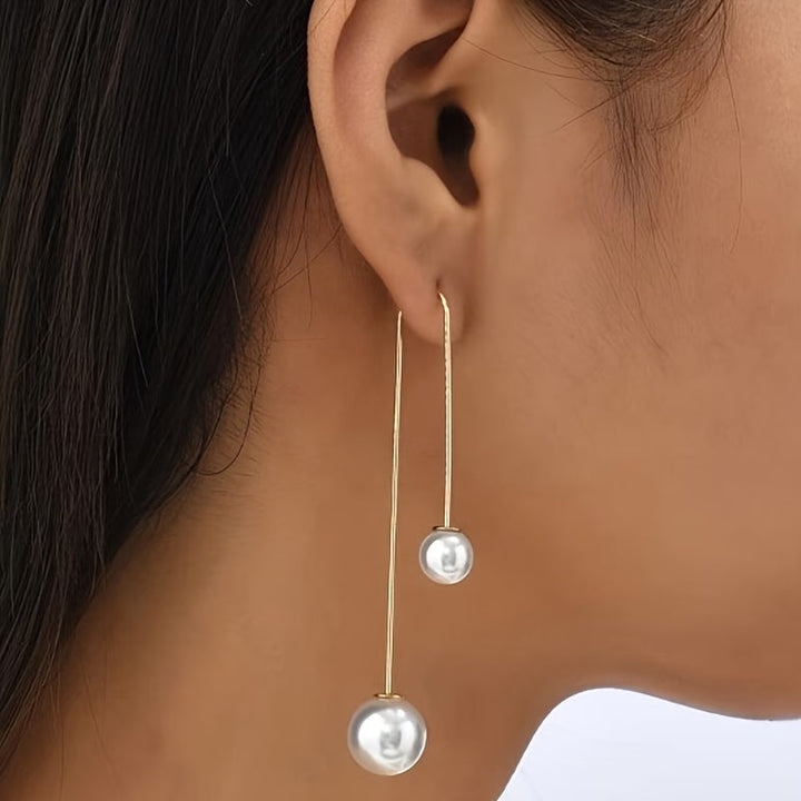 Model wearing the radiant pearl statement earrings