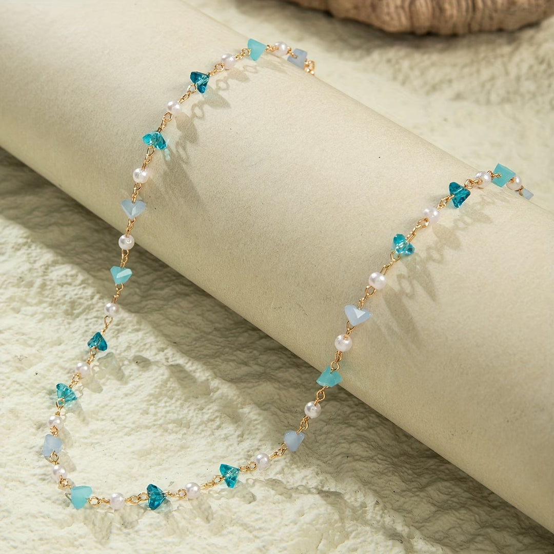 Close-up of the pearl and turquoise beads strung together