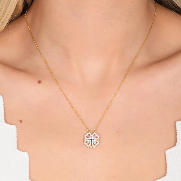Main shot of the clover necklace with heart pendant