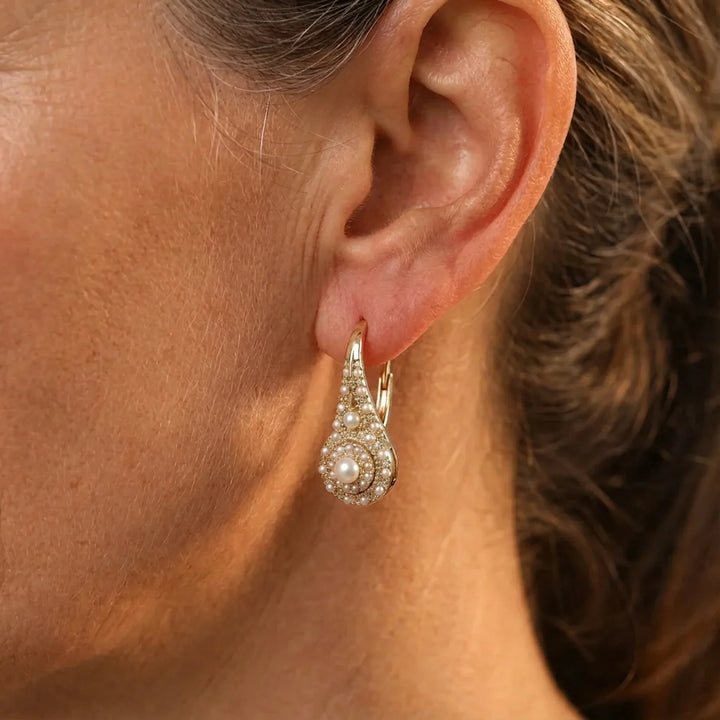 Pearl bloom earrings photographed from a side angle