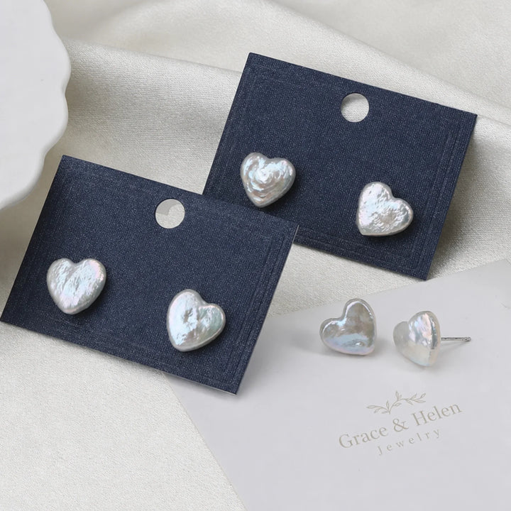 Close-up of the heart charm and dangling pearl detail