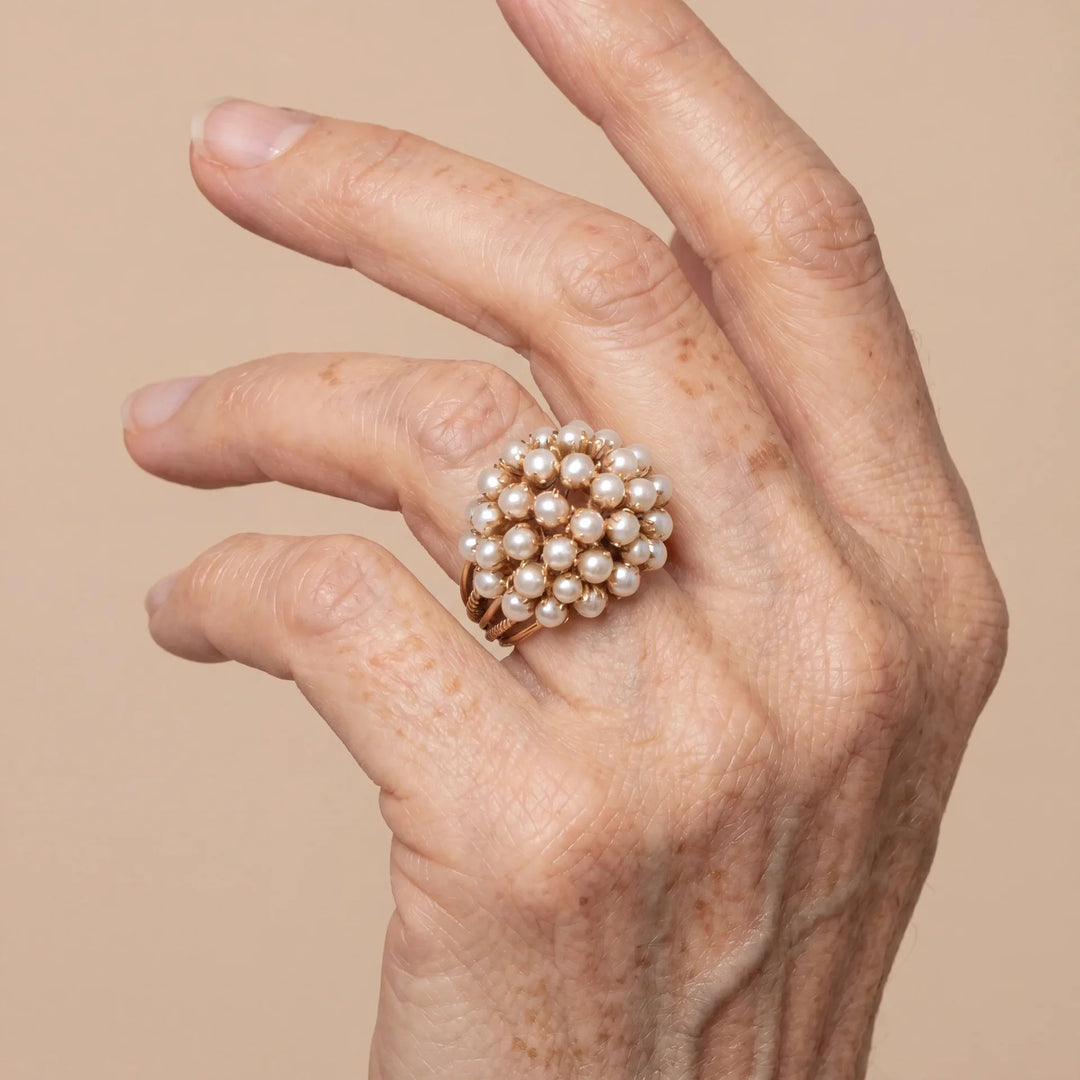 Close-up of the inlaid pearl setting on the ring band