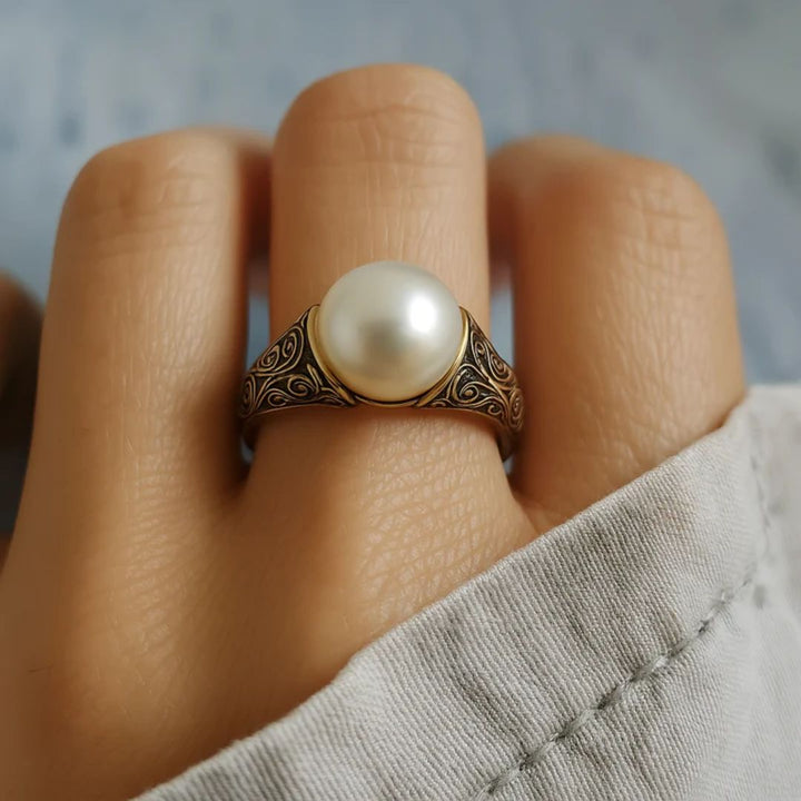 Close-up of the pearl setting on the vintage gold ring