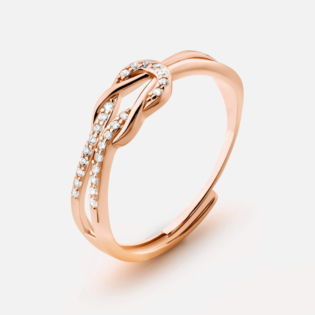 Twisted Knot Statement Ring lifestyle image on a linen surface