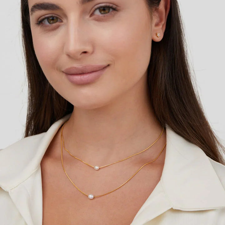 Layered pearl necklace displayed from a different angle