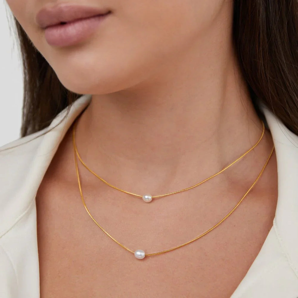 Close-up of the freshwater pearl strands on the necklace
