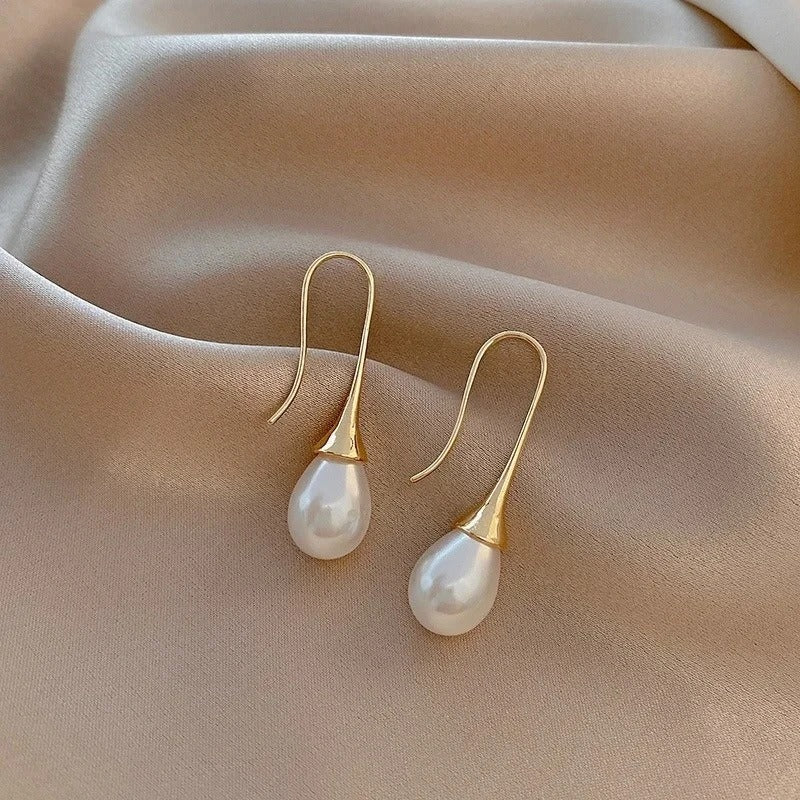 Close-up of the pearl earring highlighting its lustrous finish