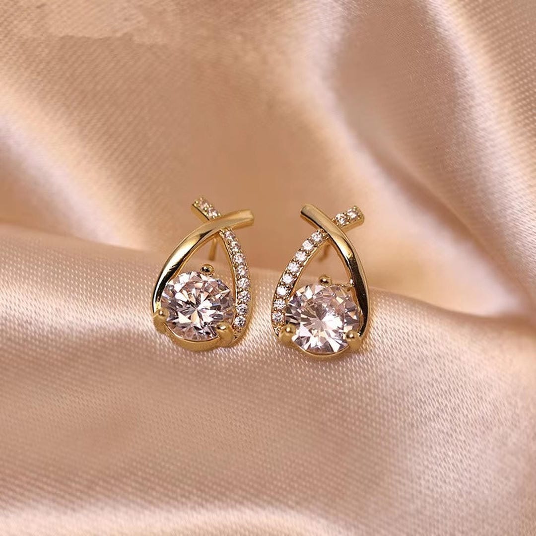 Main shot of the twisted teardrop cubic stud earrings