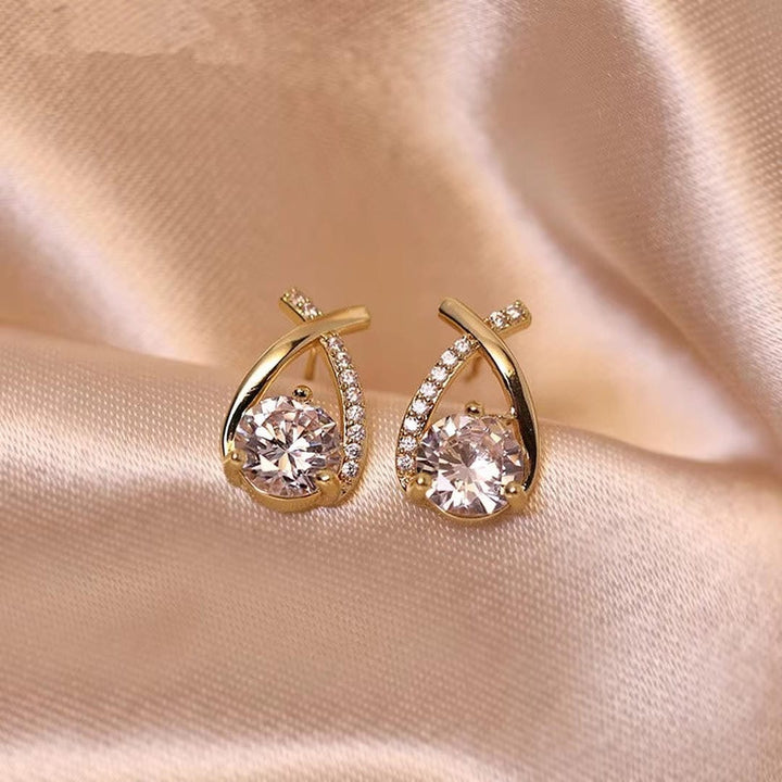 Main shot of the twisted teardrop cubic stud earrings