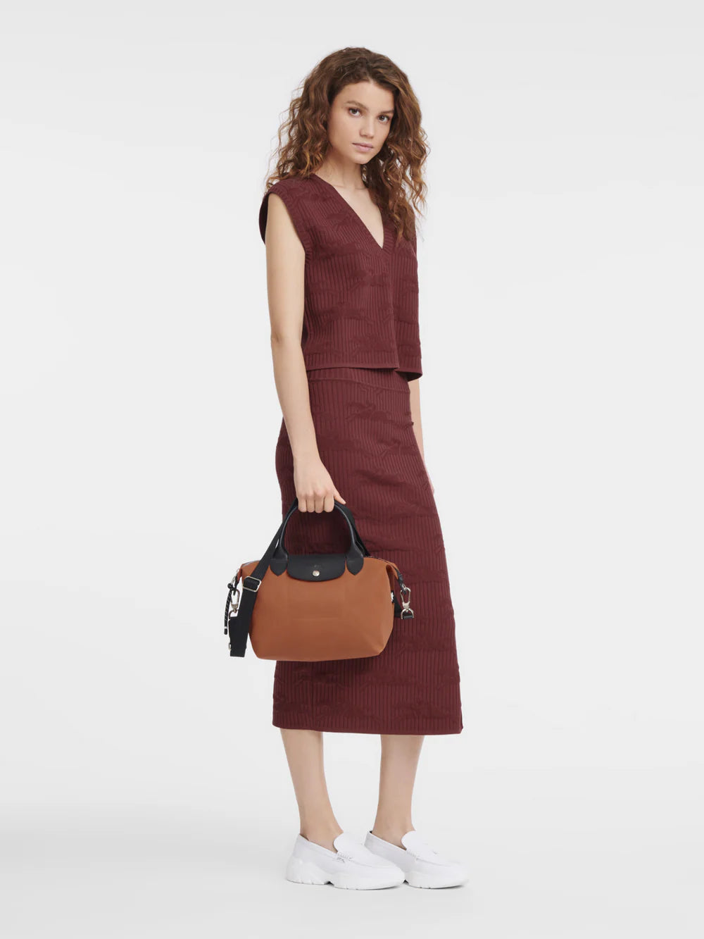 Longchamp Le Pliage Energy Small Sienna Crossbody Bag on model worn as shoulder bag sienna orange colour