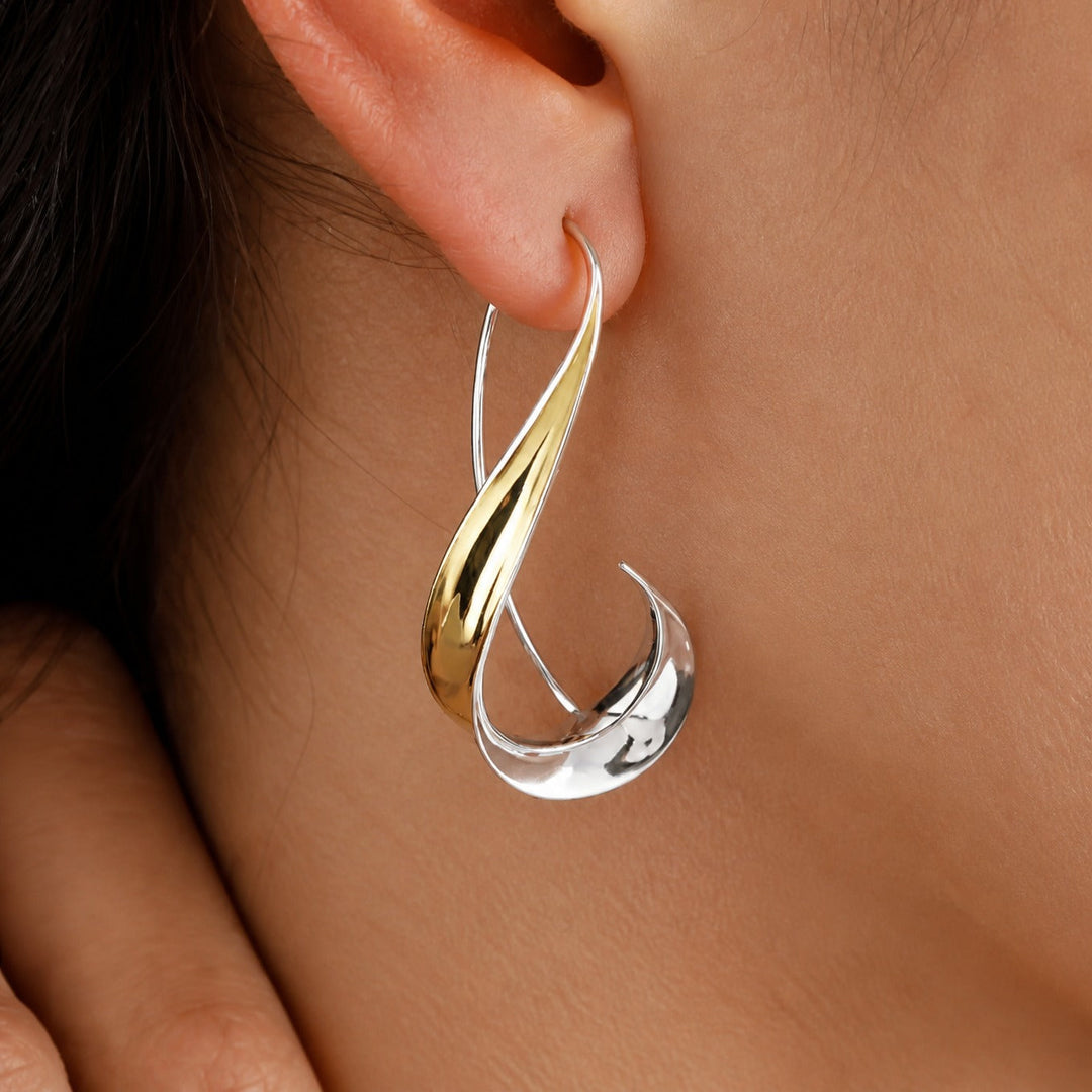 Main shot of the refined timeless gold earrings