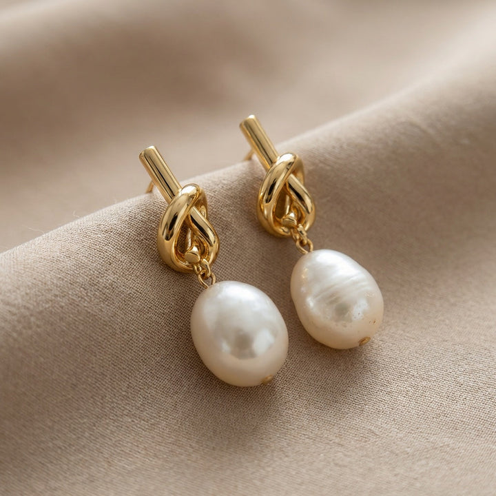 Pair of knotted earrings shown side by side