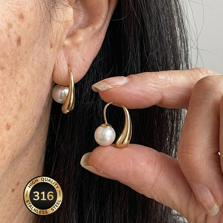 Minimalist arc pearl earrings shown as the main product shot