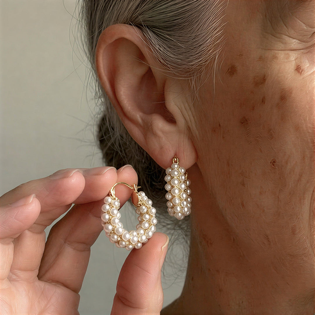Model wearing the layered pearl hoop earrings