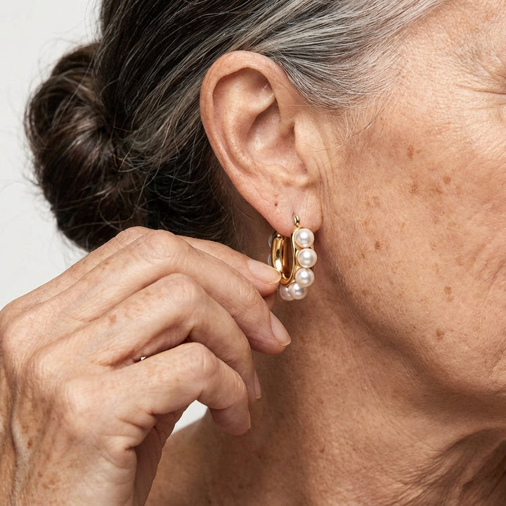 Model wearing the pearl hoop earrings styled with loose hair