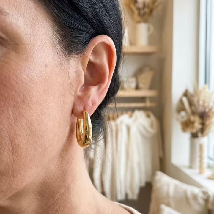 Earrings worn on a model's ear