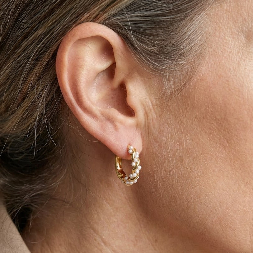 Close-up of the spiral hoop design set with pearls