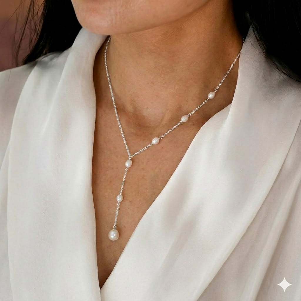 Cascading pearl lariat necklace laid out showing its full drape length
