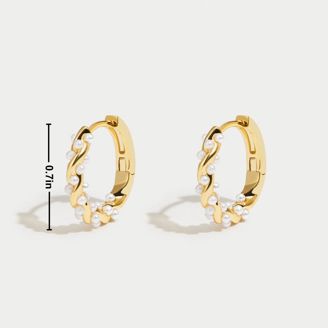 Pearl hoop earrings shown from a side angle