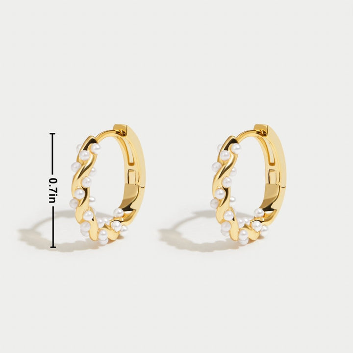 Pearl hoop earrings shown from a side angle